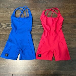 Two Kandi Kouture leotards with spaghetti strap criss- cross back. Like new!